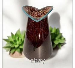 Art glass vase with tortoiseshell pattern and blue rim by Crusader Glass