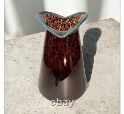 Art glass vase with tortoiseshell pattern and blue rim by Crusader Glass