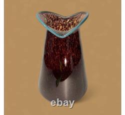 Art glass vase with tortoiseshell pattern and blue rim by Crusader Glass