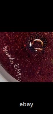 Art glass vase with tortoiseshell pattern and blue rim by Crusader Glass