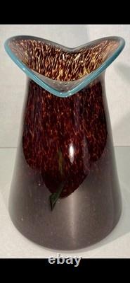 Art glass vase with tortoiseshell pattern and blue rim by Crusader Glass