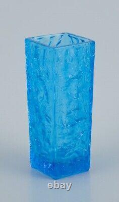 Gullaskruf, Sweden. Square-shaped glass vase and candlestick in blue art glass