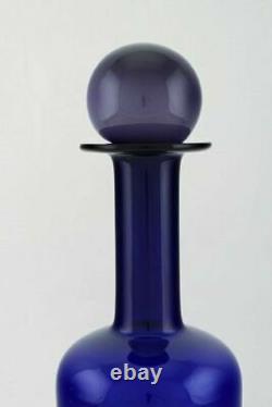 Otto Brauer for Holmegaard. Large vase / bottle in blue art glass. 1960's