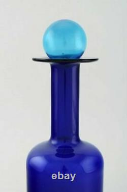 Otto Brauer for Holmegaard. Large vase / bottle in blue art glass with blue ball